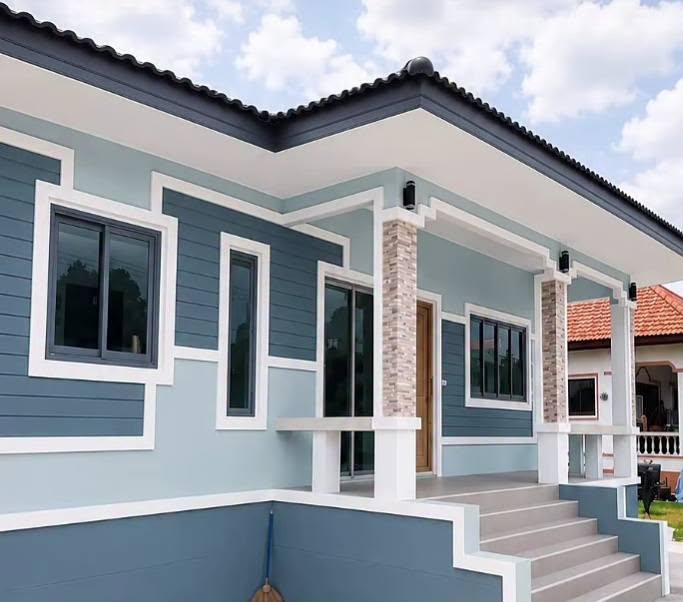 Blue-grey house exterior with crisp white trim