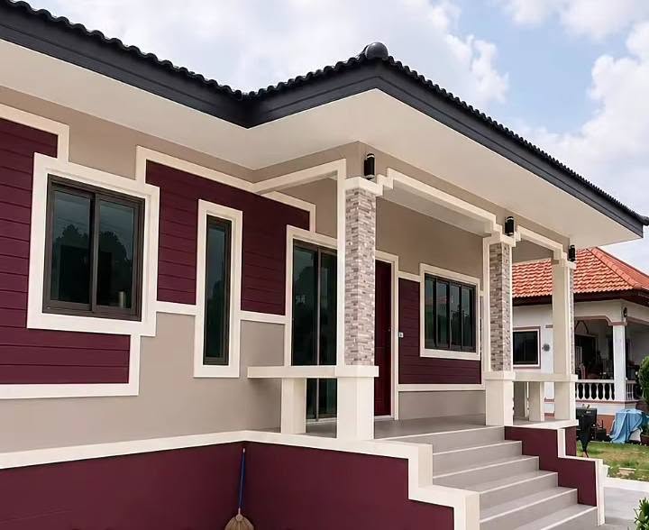 Burgundy house exterior with warm cream trim
